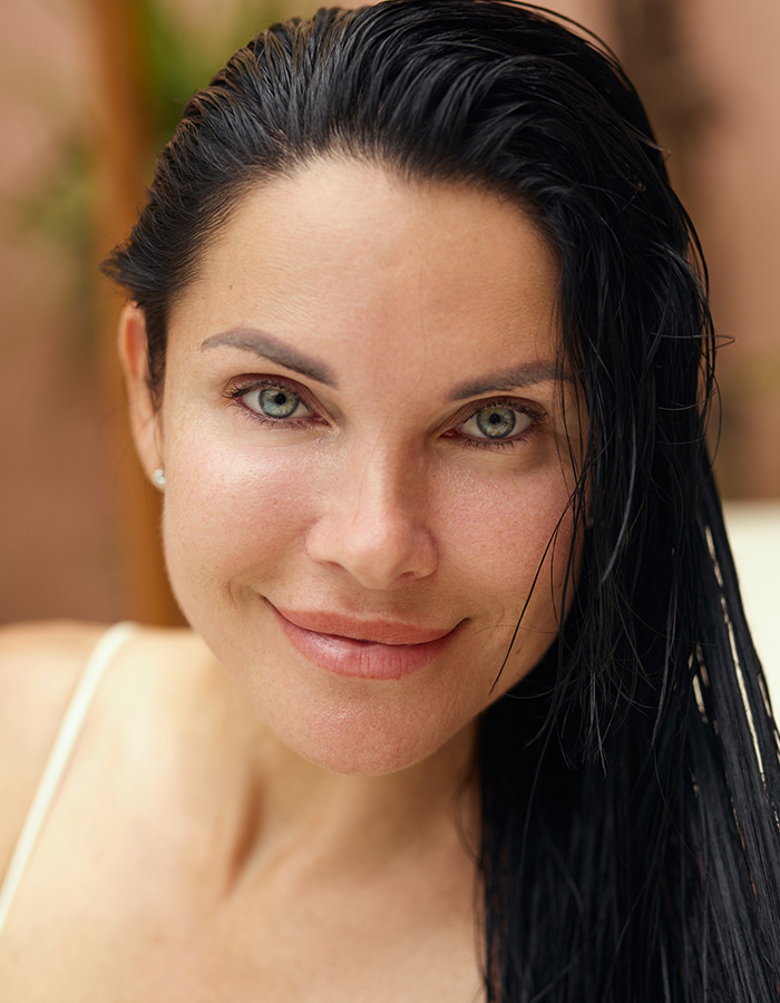 Mature woman with black hair combed back